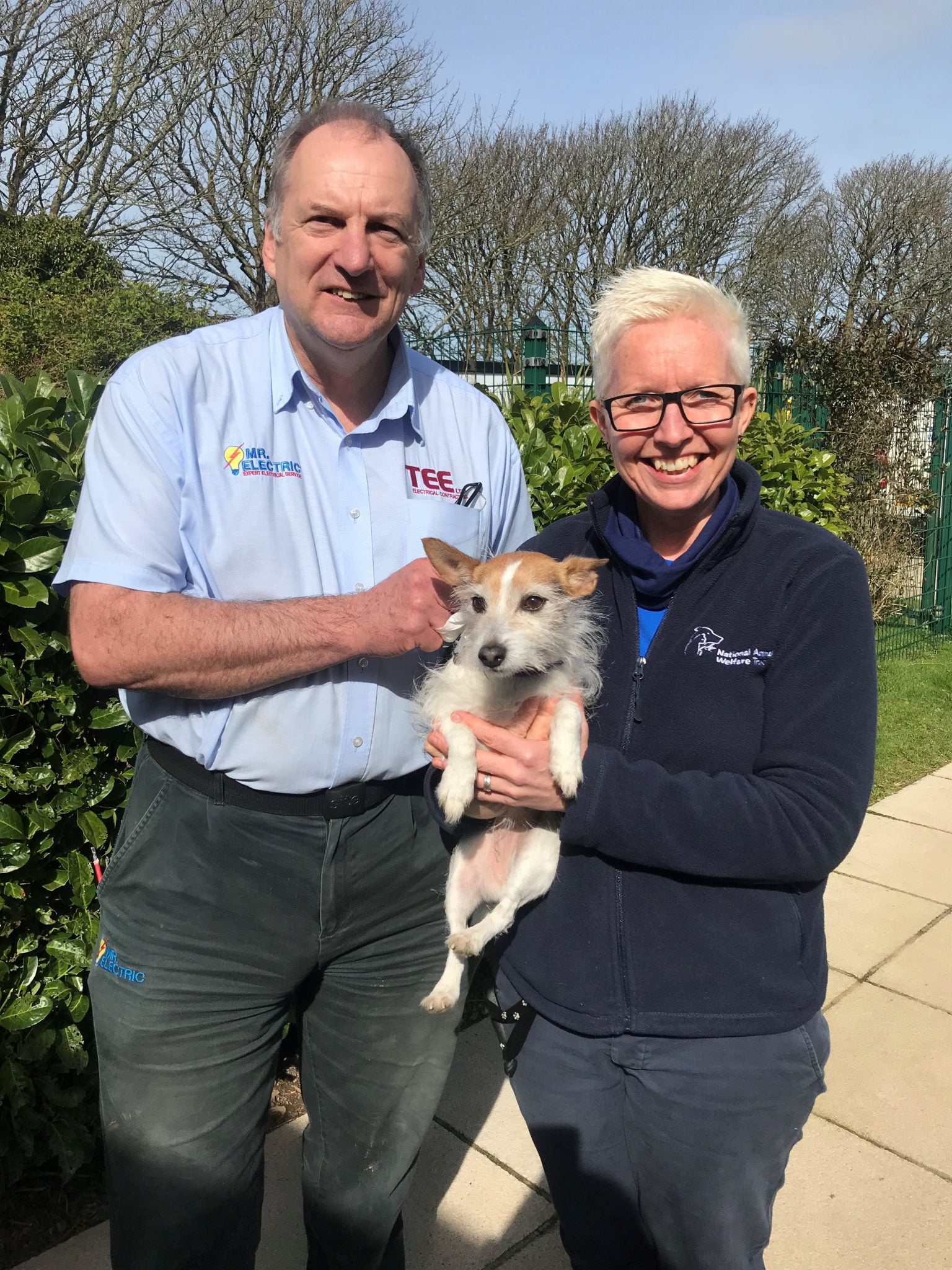 Louise Clark-Payne, Manager of Cornwall National Animal Welfare Trust with  Alan Denham of Mr. Electric Cornwall and one of the rescue dogs -  Electrical Times